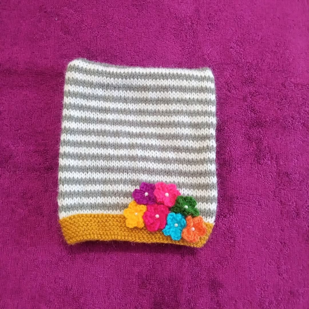 Hand Knitted Woollen Baby Cap with Crochet Flowers